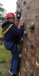 Photo of Tim on climbing wall